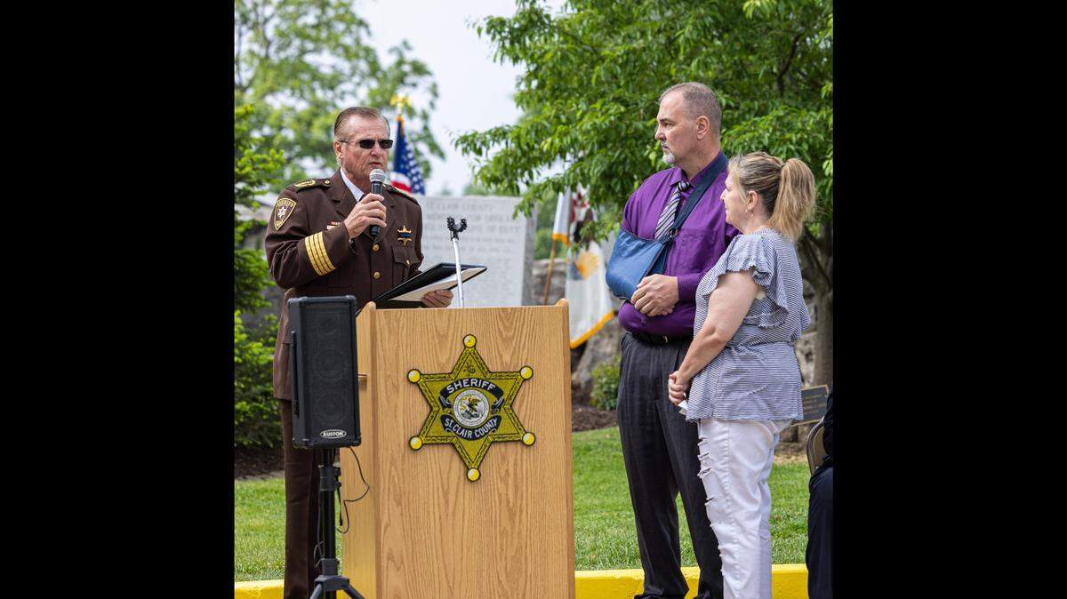 In this 2023 file photo, St. Clair County Sheriff Rick Watson presents the citation of valor award to Dupo Police Sgt. Patrick Carrier during the annual St. Clair County Law Enforcement Memorial Service. Carrier was shot in the line of duty in February 2023.