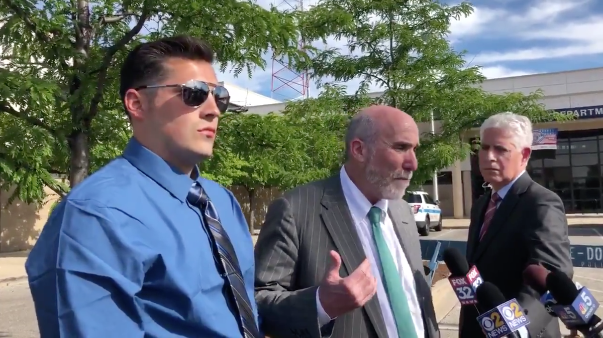 Chicago Police Officer Robert Rialmo, left, was found not guilty for punching two men in a bar fight back in December.