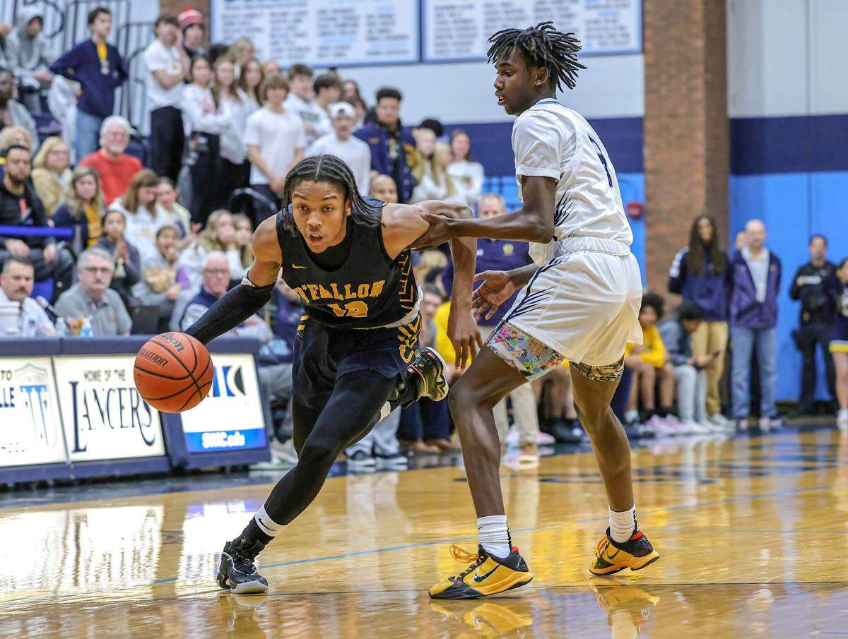 O’Fallon’s Rini Harris drives to the basket during Friday night’s Southwestern Conference game against Belleville East. The Panthers ultimately posted a 65-51 victory.
