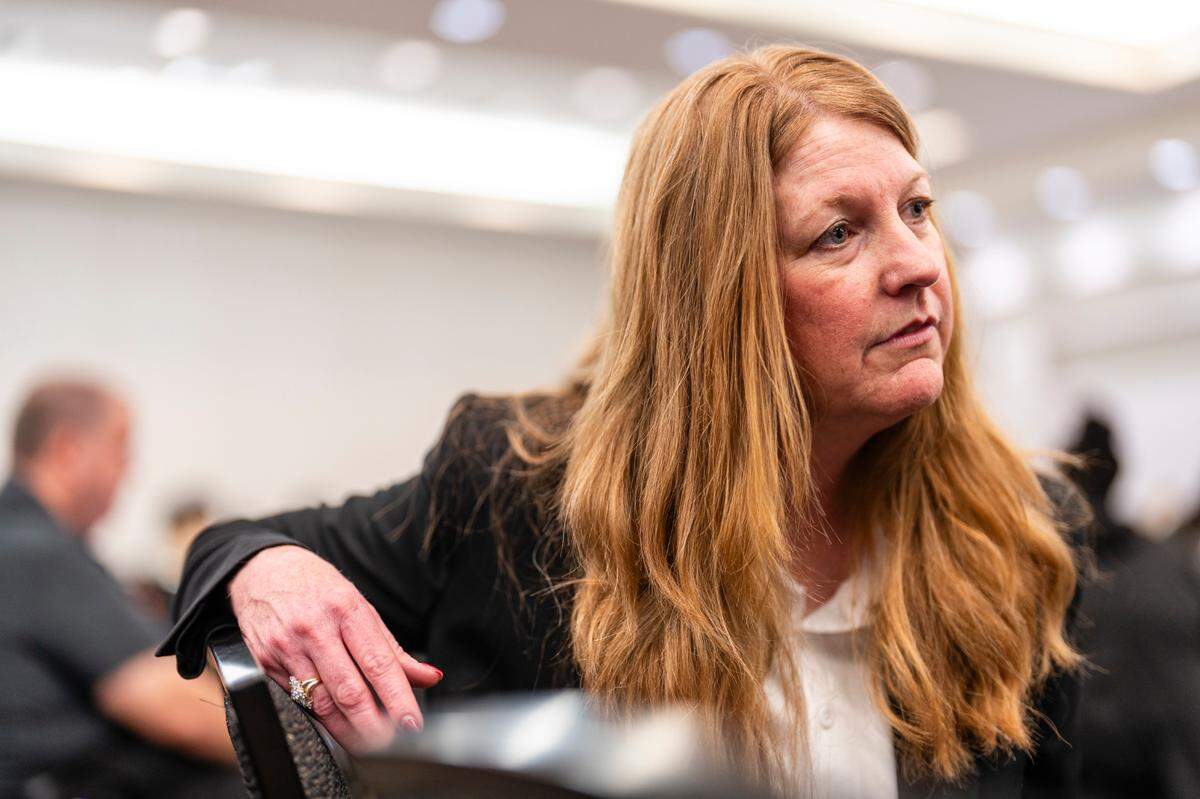 Misty Huff, the Southern Region Associate Regional Administrator of the Illinois Department of Children & Family Services (DCFS), talks during a media interview during a hiring event hosted by DCFS on Wednesday, March 27, 2024, at Fountains Conference Center in Fairview Heights. The event drew over 500 people who came to apply for potential work.