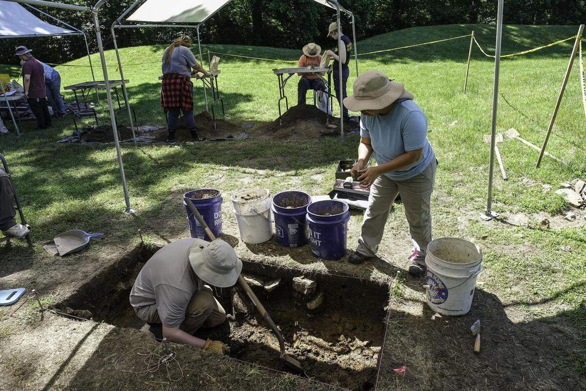 Researchers from the SIU Archaeology Field School remove soil from the site of a French fort from the early 1800s at the Fort Kaskaskia State Historic Site near Ellis Grove.