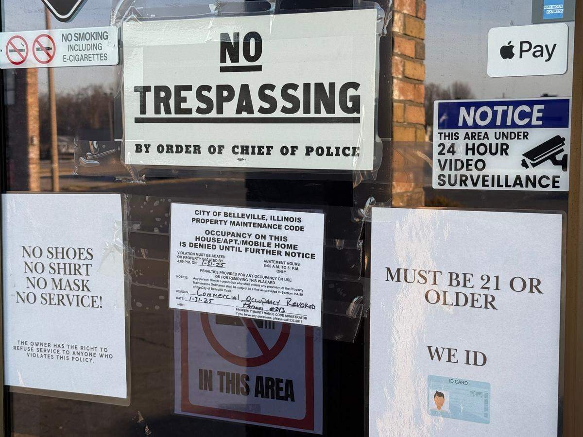 Signs on the door at the Twinzo Smoke Shop in Belleville show the police chief has ordered “no trespassing” at the store and that the business’ commercial occupancy permit was revoked Friday.