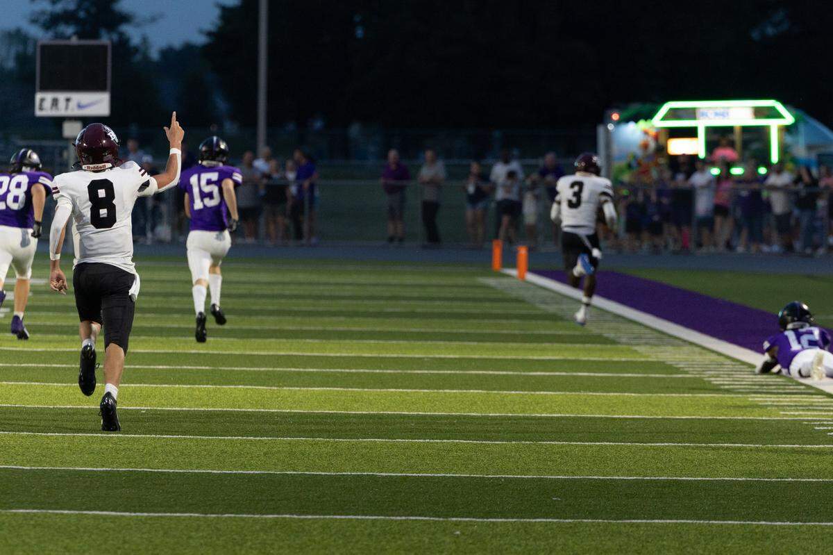 Belleville West sophomore QB Caiden Capell celebrates a touchdown during the first game of the season against on Aug. 30, 2024. By halftime, the Belleville West Maroons led the Indians by three touchdowns.