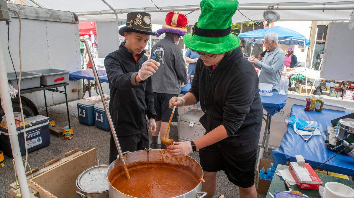 Boy Scout Troop 553 members Zachary Barshay and Andrew Reuting prepare and serve chili at the 38th annual Chili Cook-Off. Over 40 vendors, live entertainment and more highlighted this year’s event, which wrapped up Saturday night in Belleville.