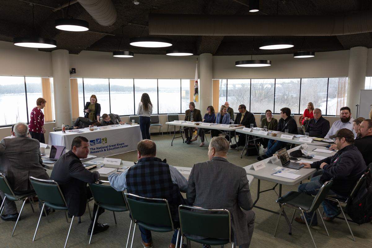 A coalition of Madison County mayors, legislators and others attend a meeting with U.S. Sen. Tammy Duckworth to discuss emerging community issues in Madison County.
