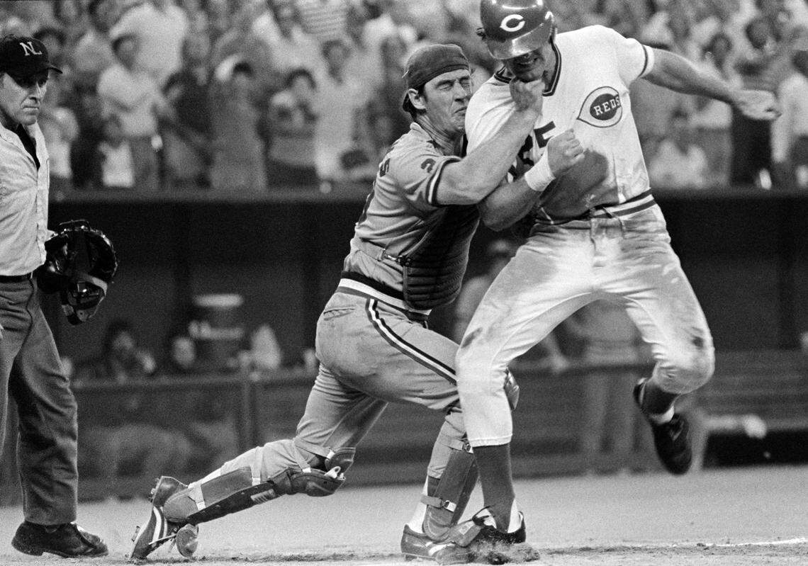 St. Louis Cardinals catcher Ted Simmons applies a right fist to the chin of Cincinnati Reds’ base runner Ray Knight, as well as tagging him in the back with the ball, for the third out in the tenth inning of the Cards’ game against the Reds, Aug. 21, 1980, in Cincinnati. (AP Photo/Ed Reinke)
