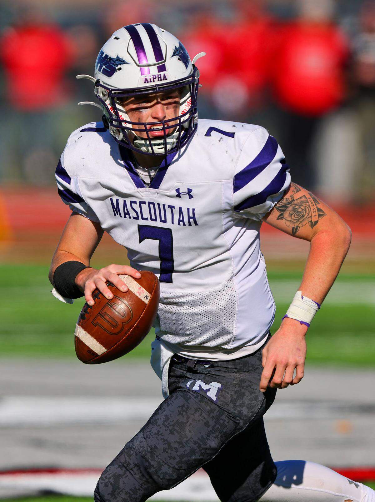 Mascoutah quarterback Zane Timon looks downfield for an open receiver during a second round IHSA Class 5A postseason game against Highland. The Indians ultimately prevailed 55-42 to advance into the quarterfinal round.