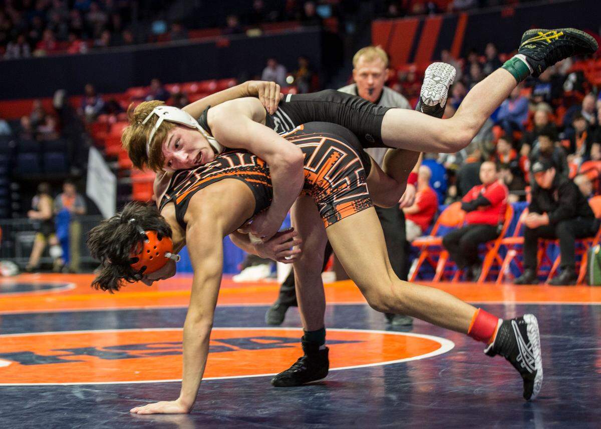 February 14, 2019 - Champaign, IL - Belleville West’s Josh Koderhandt wrestles Harlem’s Jevin Doke during their preliminary match at the Illinois High School Association opening day of state wrestling. (Photo: PhotoNews/Chris Johns)
