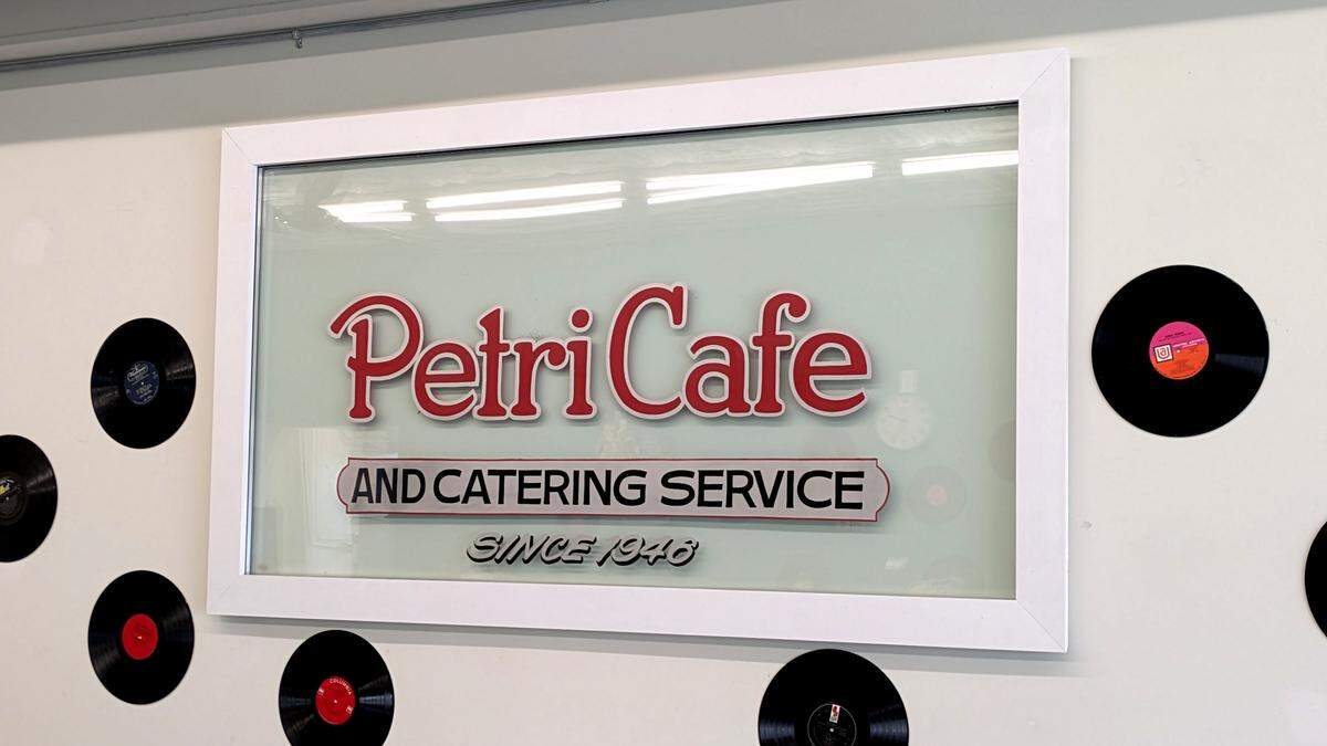 Part of the window from Petri Café still hangs on the wall at its former Granite City site.