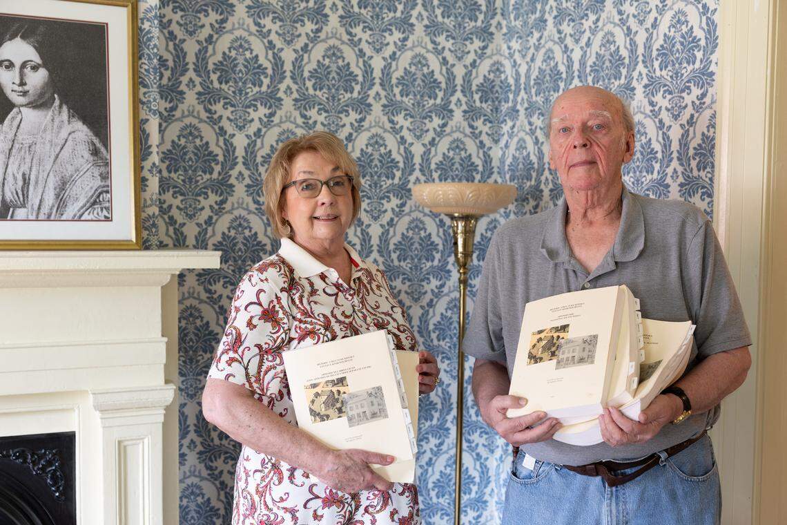 Molly McKenzie and Jack LeChien, co-chairs for the Gusave Koerner House Restoration Committee in Belleville, display a five-volume Historic Structure Report, completed in 2010. It guides every aspect of their work.