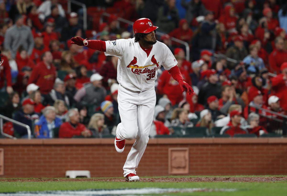 St. Louis Cardinals’ Jose Martinez hits a single during the eighth inning of Game 1 of the baseball National League Championship Series against the Washington Nationals Friday, Oct. 11, 2019, in St. Louis. (AP Photo/Jeff Roberson)