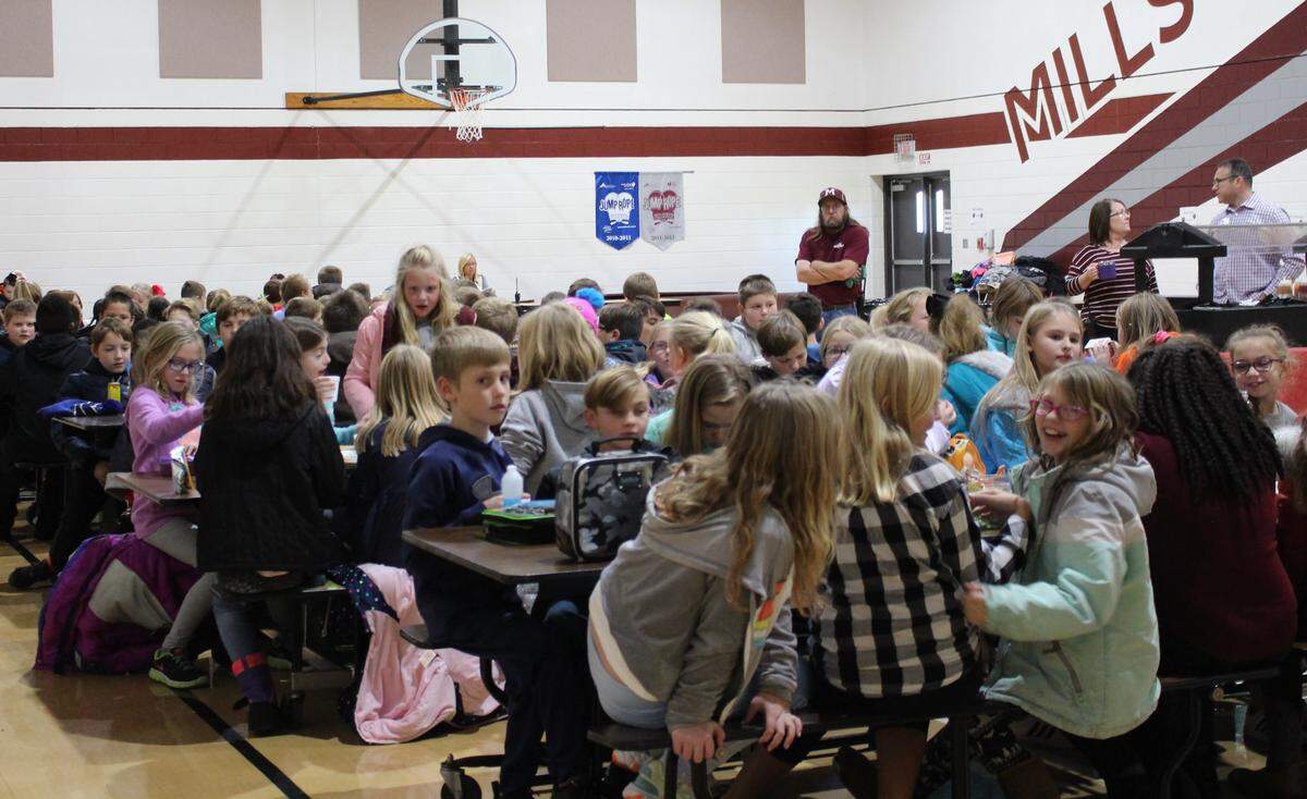 Students at Millstadt Consolidated School eat in the cafeteria on Friday. Some qualify for free or reduced lunches. Others pay $2.40. The program is subsidized by the state of Illinois.