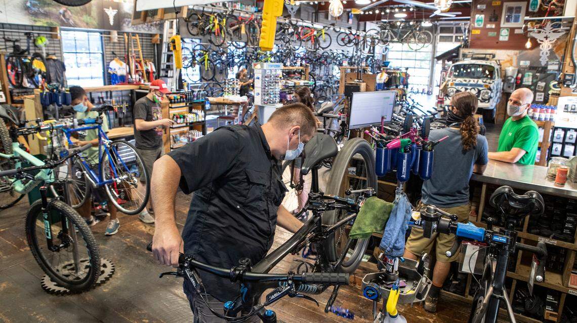“Big” Mike Eschmann works on a customer’s bike in the service area of Bike Surgeon in O’Fallon, which has stayed busy since COVID-19 hit the region.