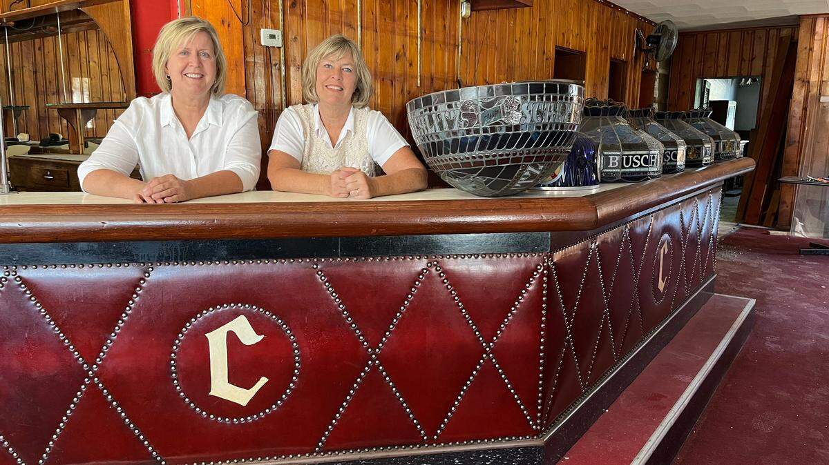 Sisters Barb Swantner, left, and Beth Rund stand behind the bar at Charlie’s Off Main, a restaurant and bar that they’re renovating and reopening on Mascoutah Avenue in Belleville.