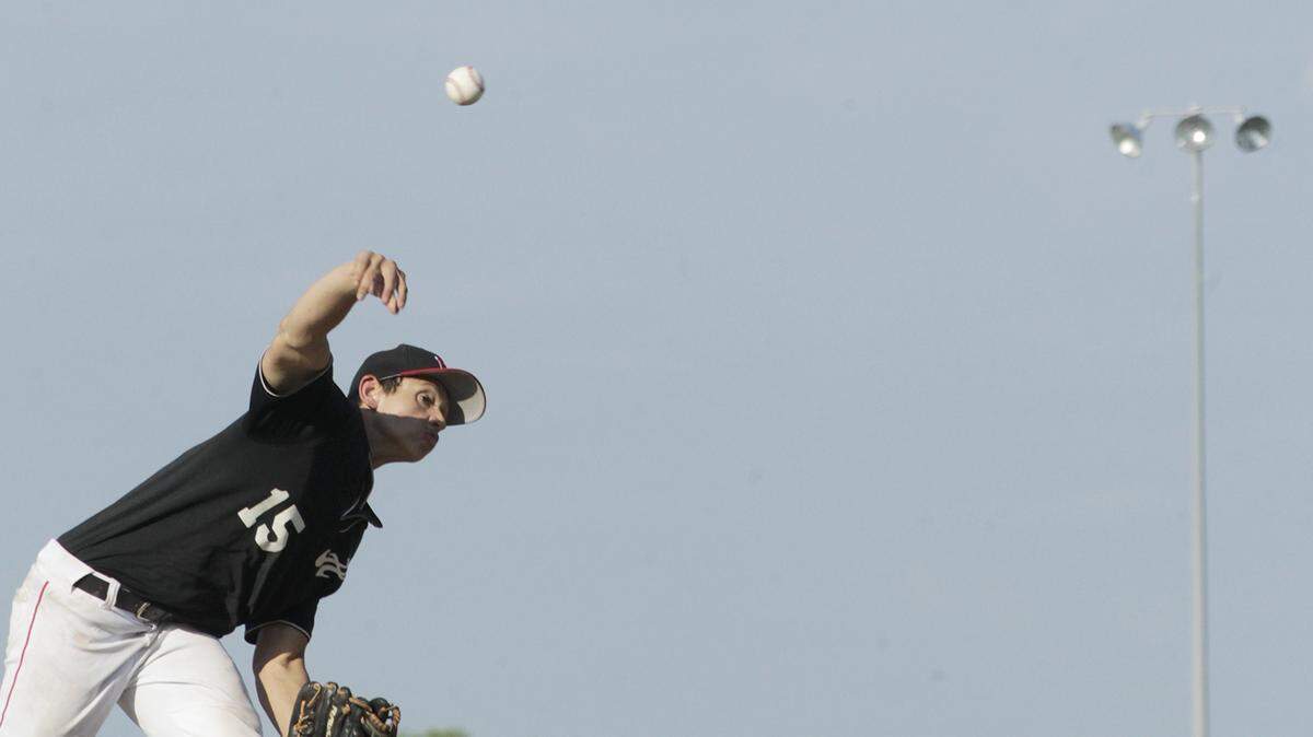 Steven Diaz delivers in pitch in game one of Highland's doubleheader with East St. Louis.
