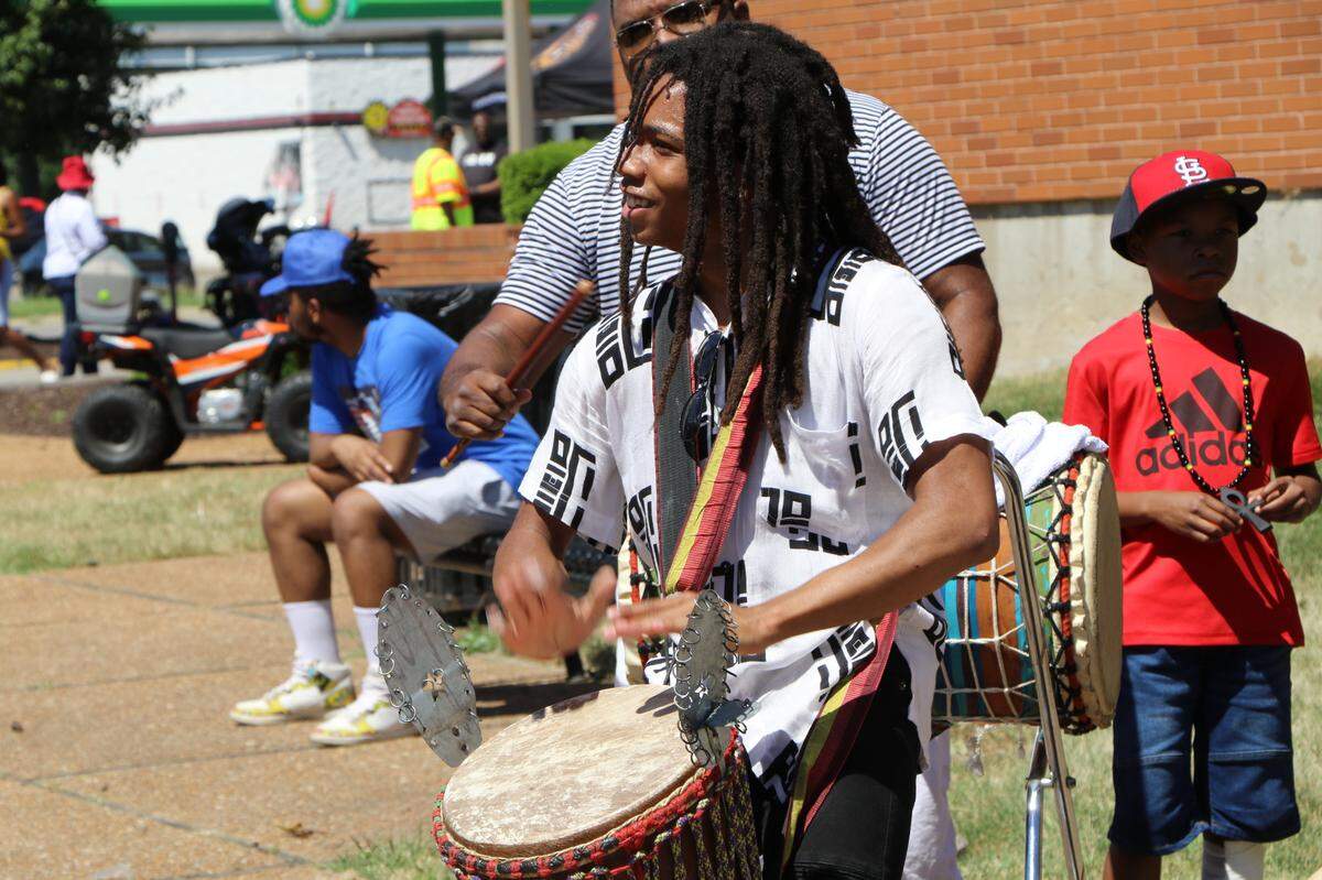 Jahja Uwizeye, 16, of St. Louis plays drums as part of the East St. Louis Community Performance Ensemble on Saturday during Juneteenth celebrations. Uwizeye is a professional African drum and dance performer.