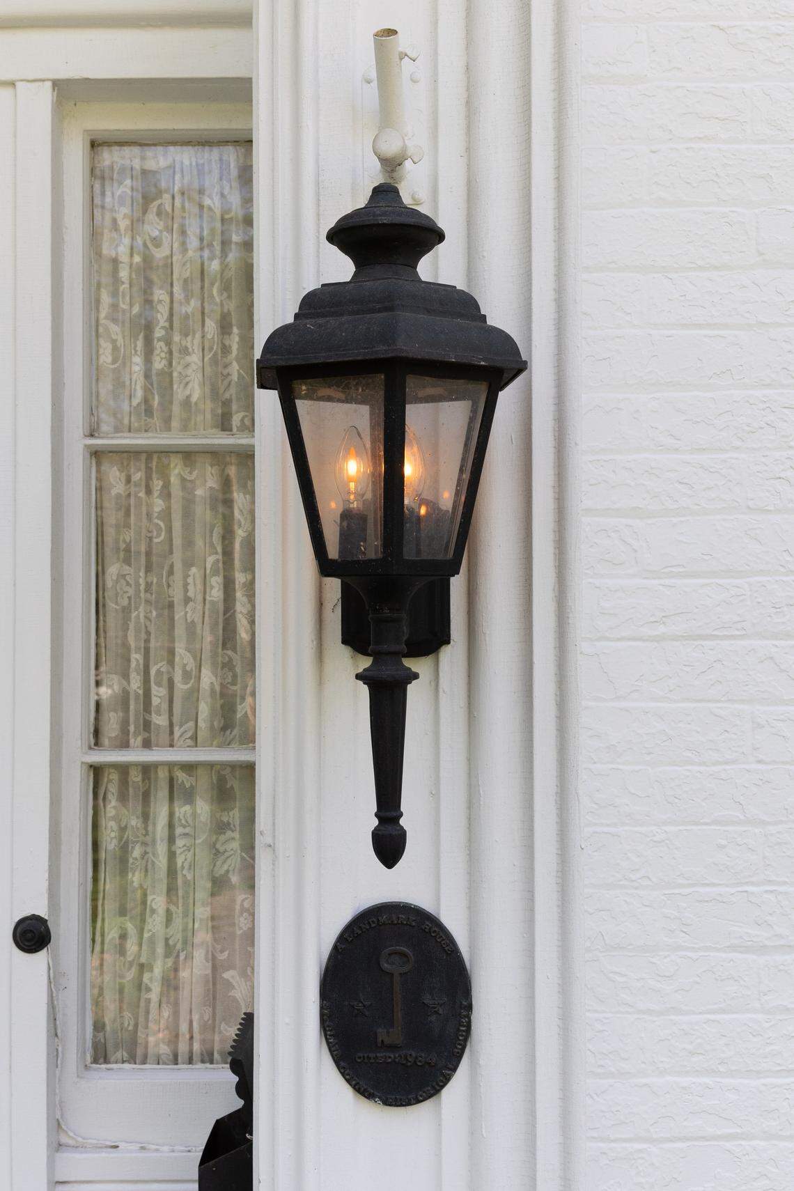 Cast-iron lamps provide ample light to the exterior of the home.