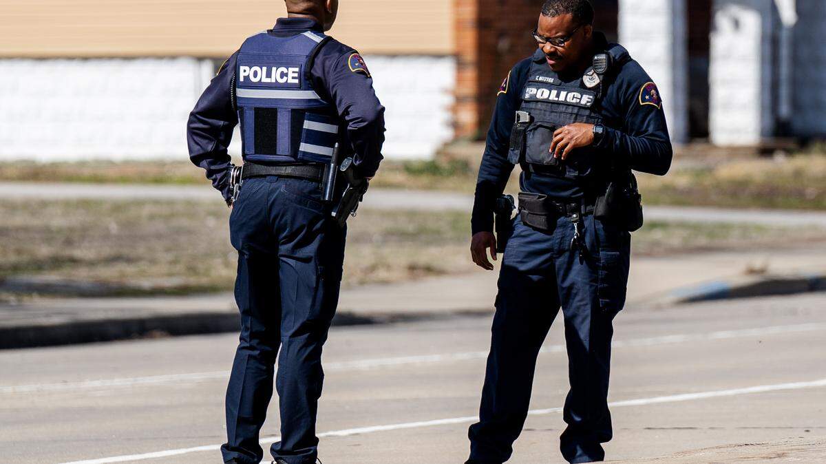 East St. Louis police officers respond to a scene where law enforcement reports a man was shot to death on Monday, March 6, 2023, near Exchange Avenue and 9th Streets in East St. Louis.