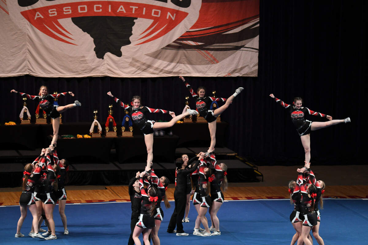 The Highland varsity cheerleaders perform at the Illinois Cheerleading Coaches Association Championship Competition in Springfield on Saturday, Jan. 8. Highland ultimately brought home the ICCA Coed Championship title for 2022, executing a routine filled with difficult skills.