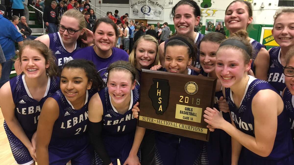 Members of the Lebanon girls basketball team celebrate their win over Lewistown in the Class 1A Supersectional at Brown County High School Monday. The victory sends the Greyhounds to their first state tournament.