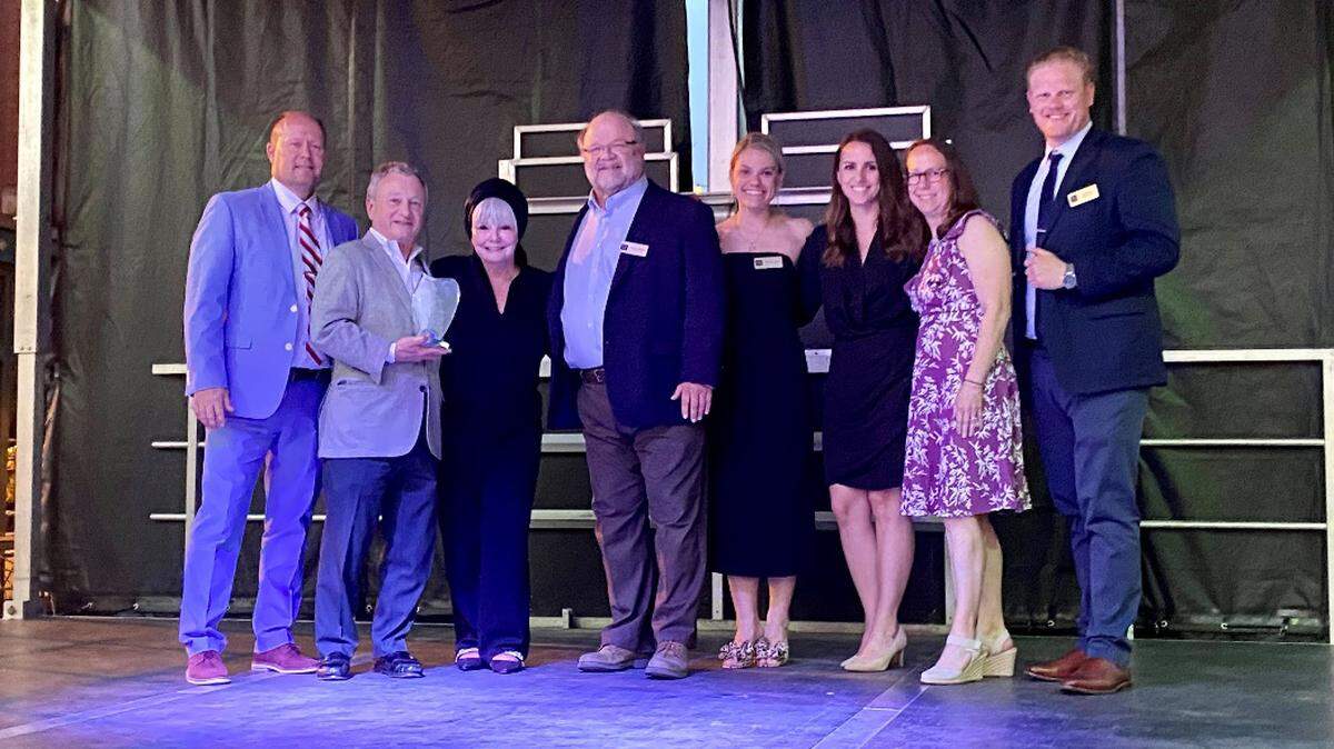 From left to right: Dr. Ryan Boike (award presenter), Patrick B. Mathis (MMR shareholder), Patty Gregory (mayor of Belleville), Kevin J. Richter (MMR shareholder), Allyson T. Schwab (MMR shareholder), Melissa C. Meirink (MMR shareholder), Laura E. Schrick (MMR shareholder), Chad J. Richter (MMR shareholder)