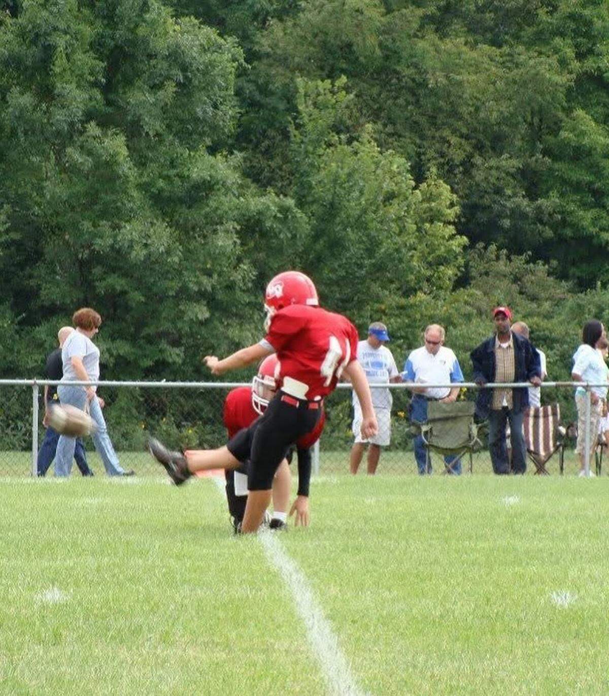 A young Austin Seibert boots one for the Belleville Little Devils.