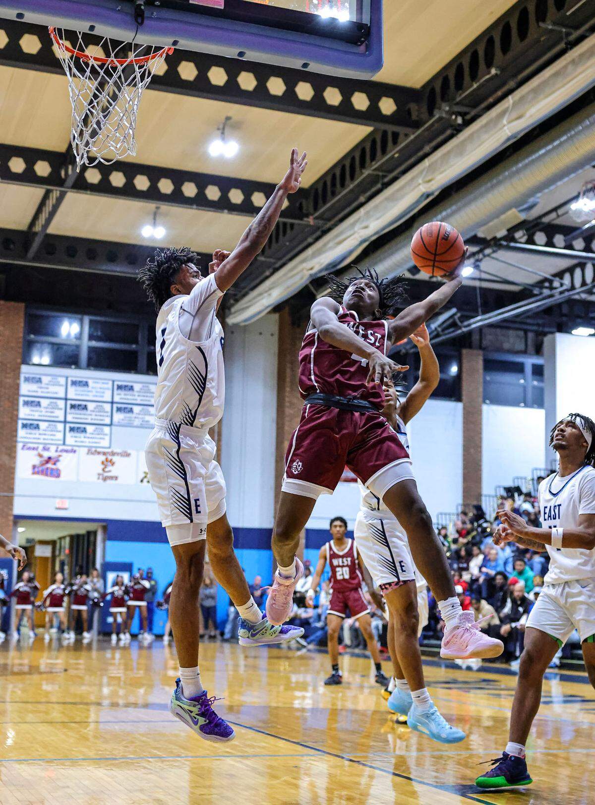 Belleville West’s Brandon Scott puts up a shot during Friday night’s Southwestern Conference game against Belleville East. The Maroons ultimately lost 66-57.