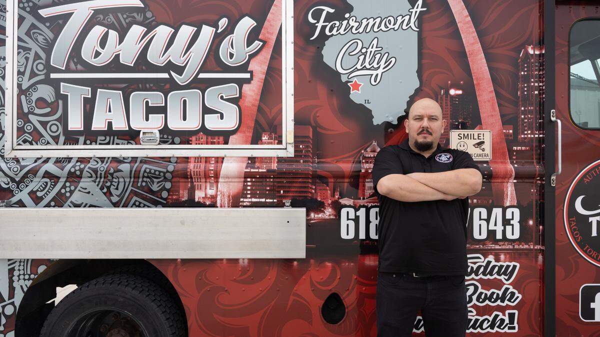 Tony Oseguera, the proprietor of Tony’s Tacos in Belleville, stands next to his food truck.