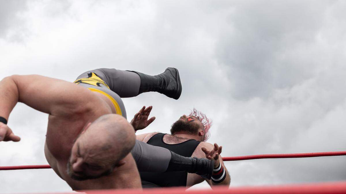 Belleville, Ill. local wrestler Bobby D takes a kick to the chest from “Superstar” Steve Fender during the Enjoy Illinois 300 Cup Race at WorldWide Technology Raceway in Madison, Ill. on June 1, 2024.