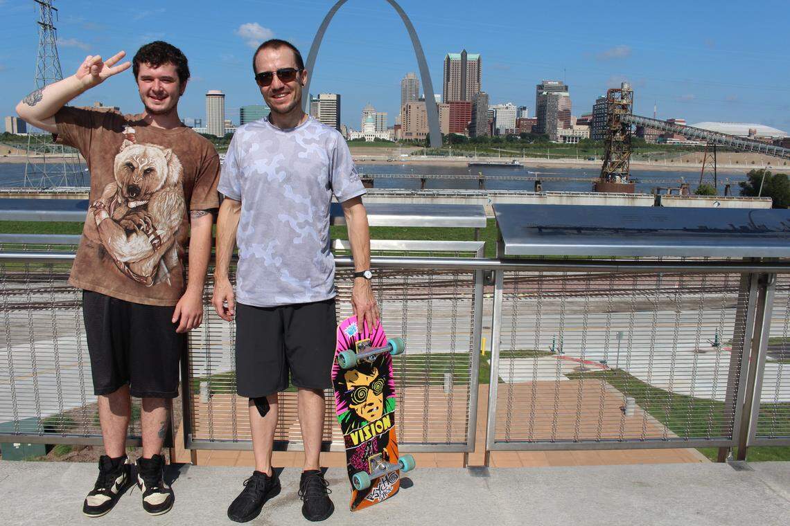 David Horvath, left, and Jason Stilp pose for photos at Malcolm W. Martin Memorial Park in East St. Louis, making a quick stop while driving from Colorado to New York City last week.