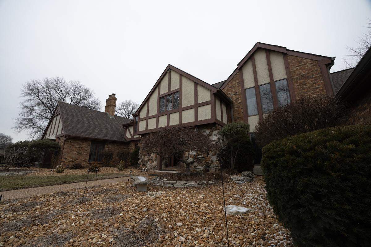 The front door of the home is lined with Tudor beams, highlighting its elegance.
