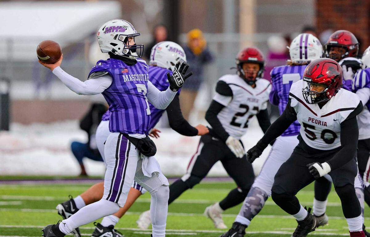 Mascoutah quarterback Zane Timon looks downfield for an open receiver during Saturday’s IHSA Class 5A quarterfinal game against Peoria High School. The Indians led 21-14 at halftime but ultimately fell to the Lions 36-21.