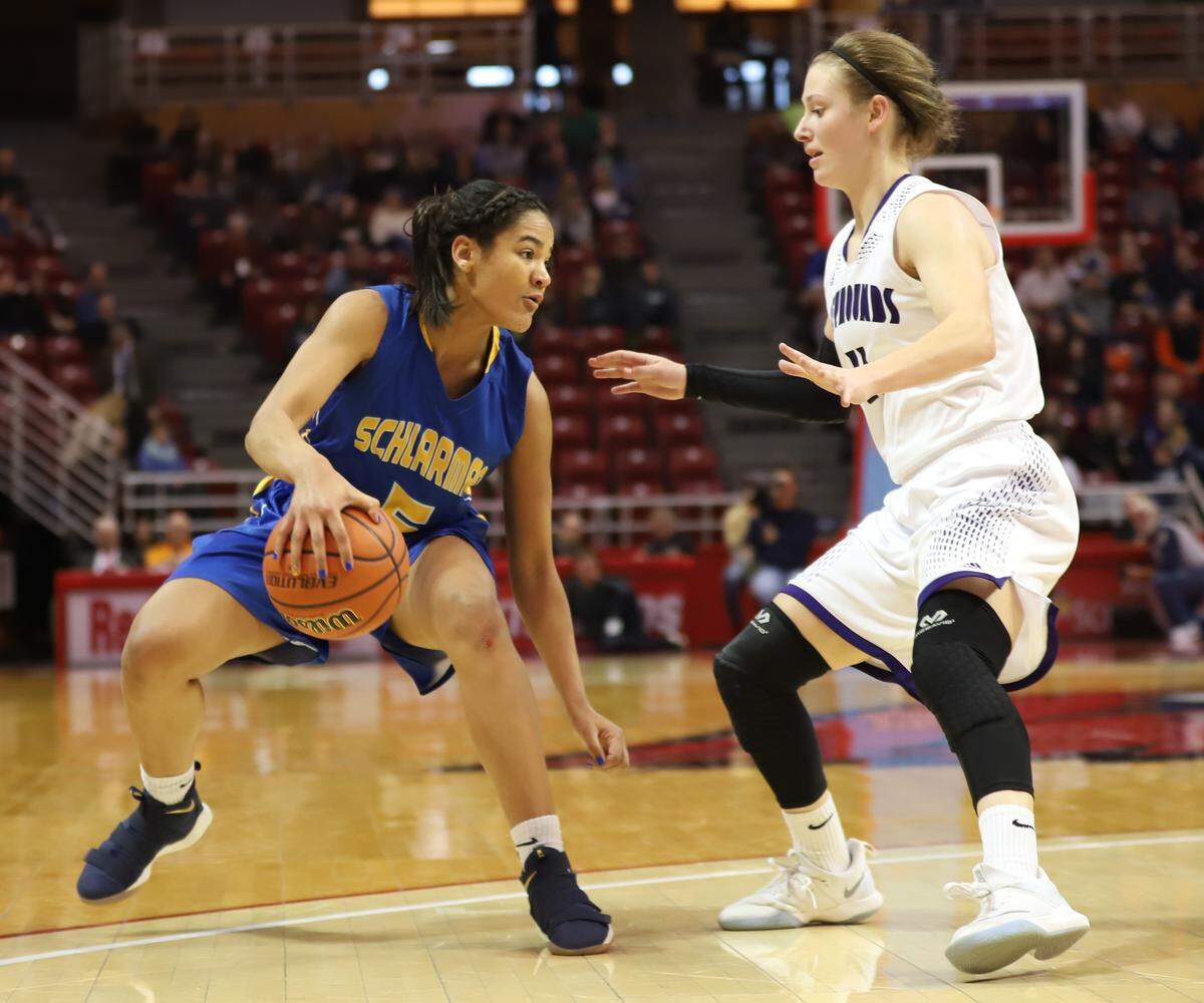 Lebanon junior Emily Reinneck guards Schlarman Academy junior Anaya Peoples during the second half of the IHSA Class 1A state semifinals Friday afternoon at Redbird Arena in Normal.
