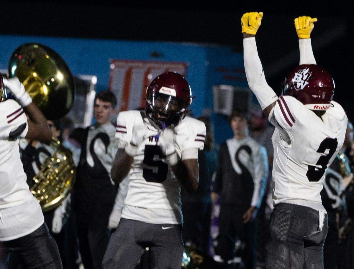 Belleville West senior Dashaun Gage Jr. (center no. 5) celebrates an intercepted touchdown during the first game of the season against Mascoutah on Aug. 30, 2024.