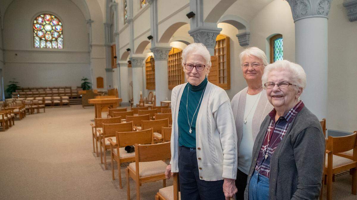 Sisters Raphael Ann Drone, left to right, Barbara Hudock and Regina Siegfried pause for a photo in the chapel of the Adorers of the Blood of Christ convent in Ruma during a recent tour.