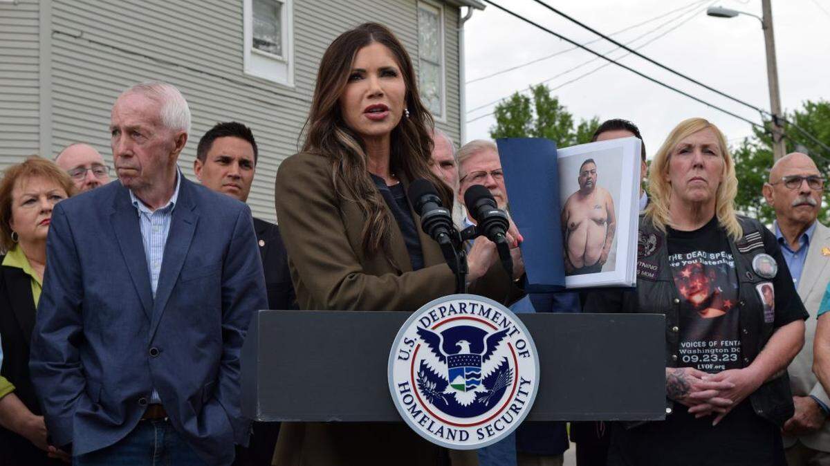 DHS Secretary Kristi Noem speaks in front of a house in the neighborhood where progressive activist Emma Shafer was murdered in 2023. 