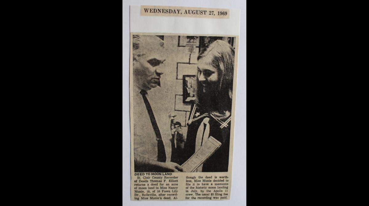 This 1969 news clipping shows St. Clair County Recorder of Deeds Thomas F. Elliott recording Nancy Munie’s deed for an acre of land on the moon.