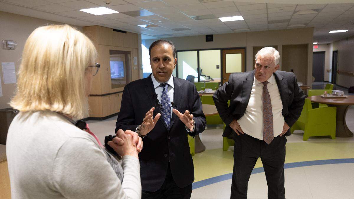 U.S. Rep. Raja Krishnamoorthi (center) speaks with staff of Touchette Regional Hospital in Cahokia Heights while on a tour of the metro-east hospital.