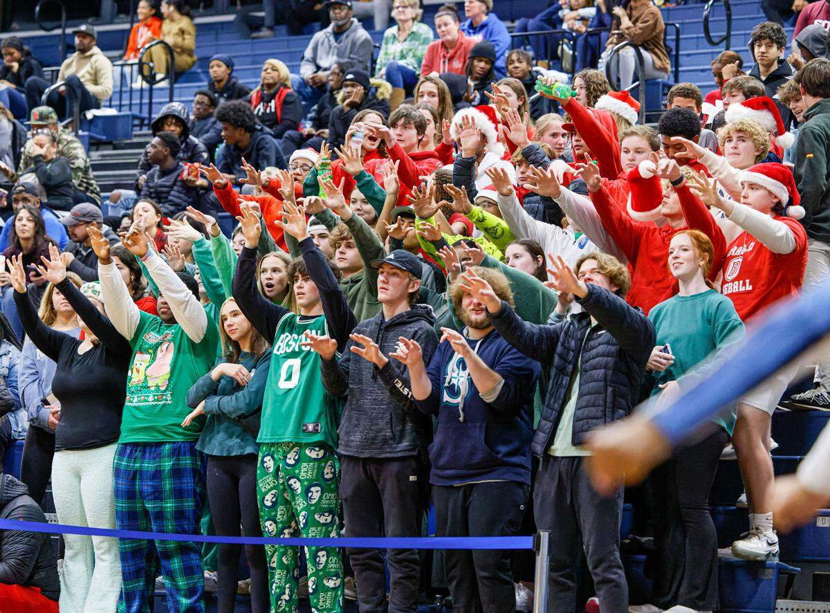 Belleville East fans show their spirit during Tuesday’s non-conference game against Althoff. The Lancers faithful was rewarded with a 78-50 victory against the Crusaders.