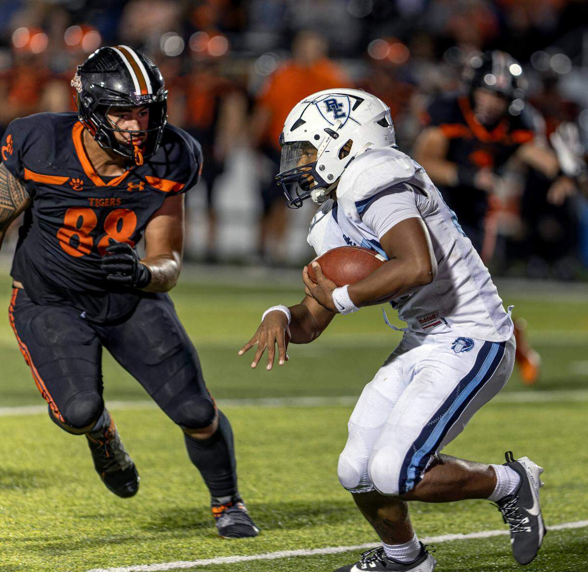 October 11, 2024 - Edwardsville IL, Belleville East Machai Henderson (22) runs the ball against Iose Epenesa (88) during FridayÕs Southwestern Conference matchup between Belleville East and Edwardsville. [Photo: Jimmy Simmons]