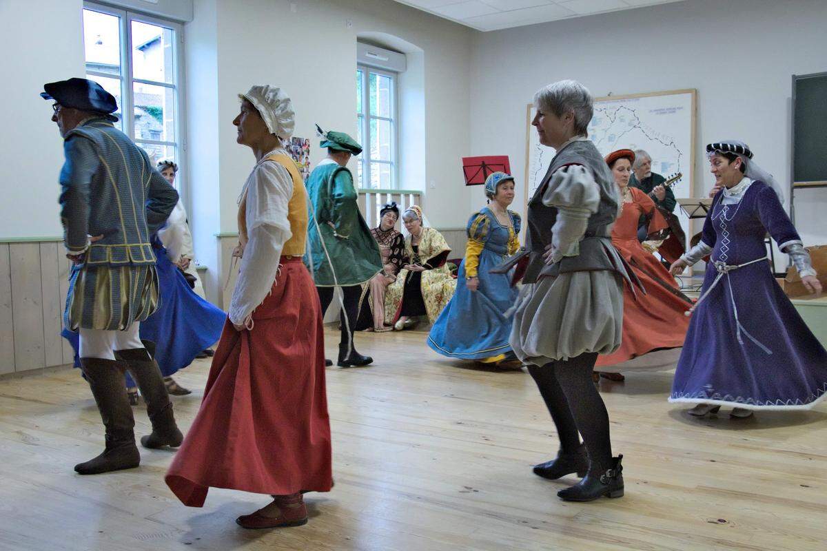 Annie Almoguera, far right, is shown at a traditional folk dance in France last year. She often sends photos of her family and activities to her American pen pal, Mary Wilson.