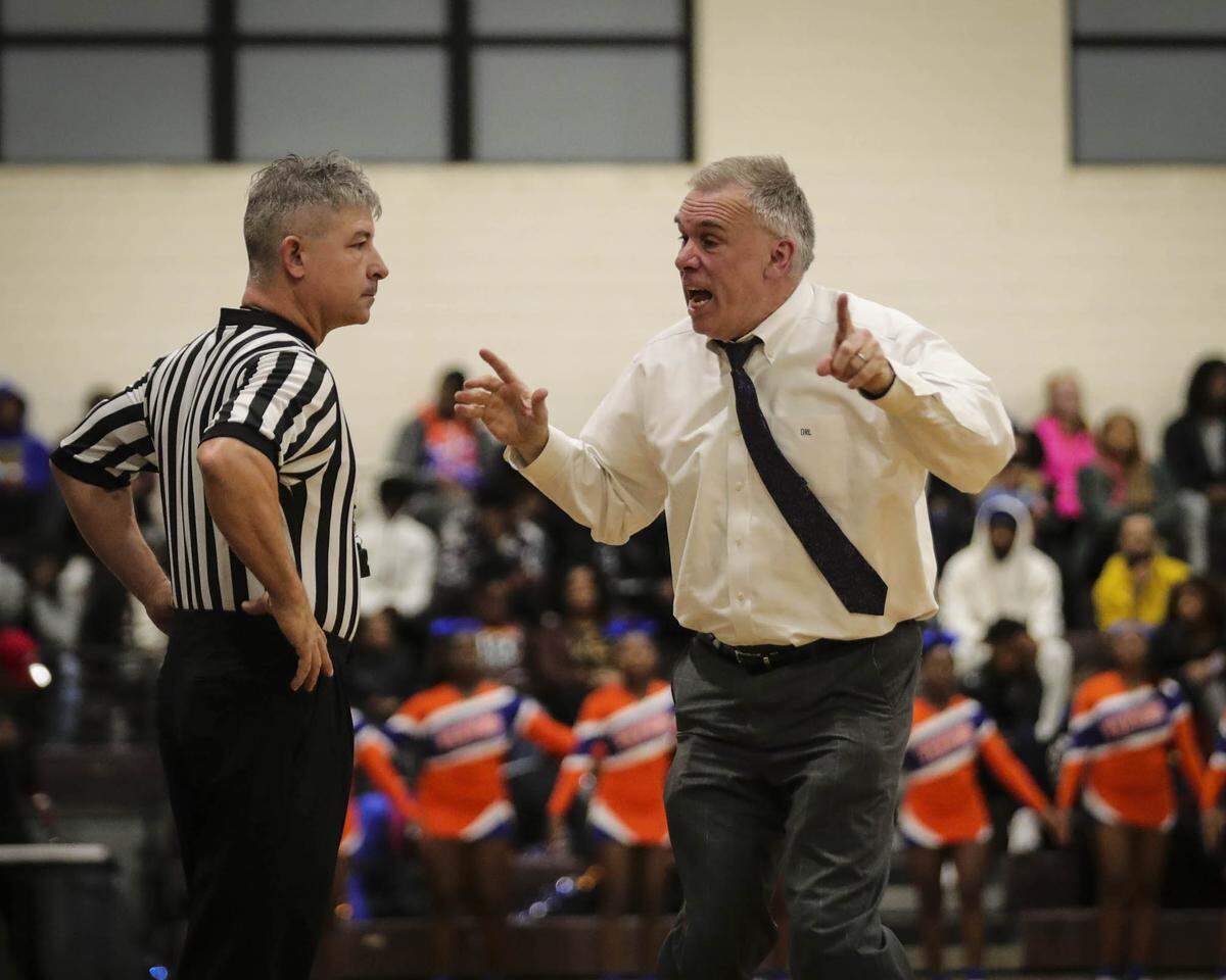 Collinsville’s head coach Darin Lee argues a controversial call late in the game during Friday night’s Southwestern Conference contest against East St. Louis. The Kahoks ultimately posted a 56-49 victory.