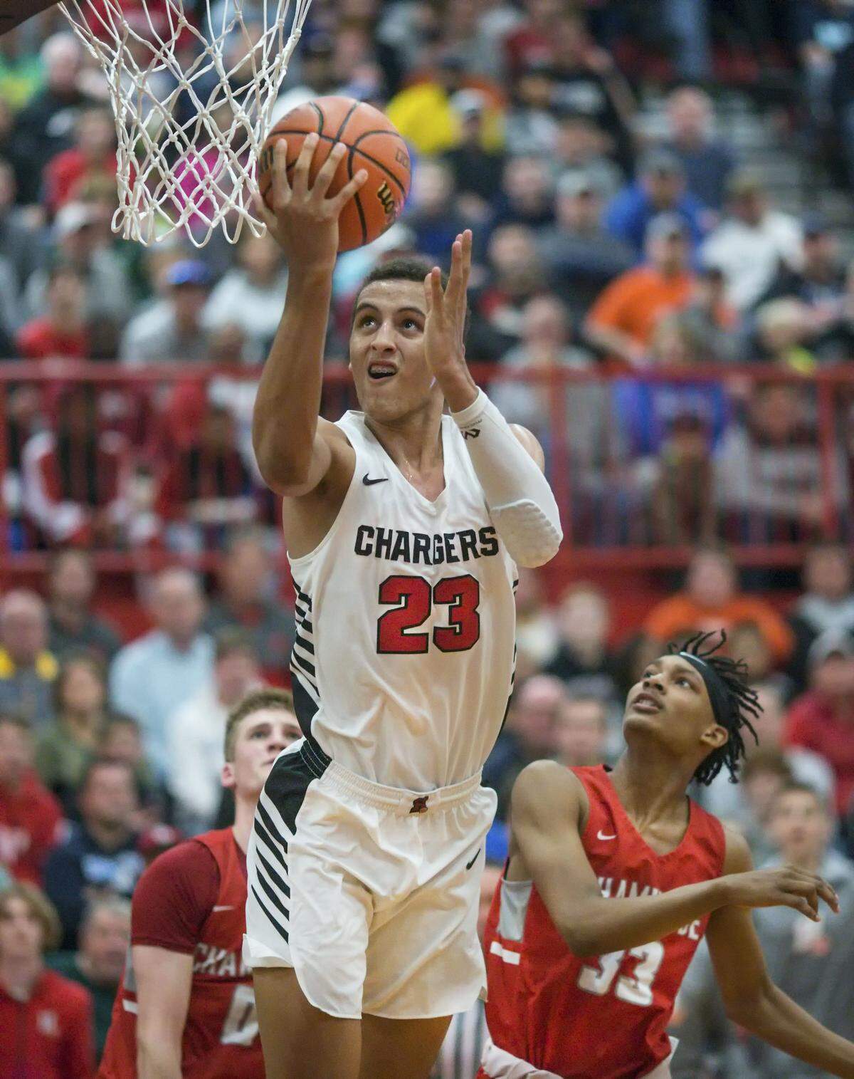Patrick Baldwin, Jr., of Hamilton Sussex, Wisconsin, converts a reverse layup during the Highland Optimist Scott Credit Union Shootout in 2020. The 31st edition of the shootout — which attracts some of the top basketball talent locally and nationally — will take place Saturday, Jan. 6.
