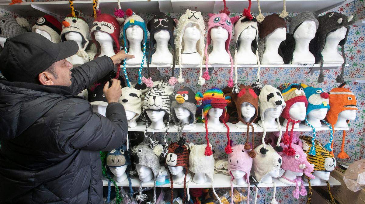 Shyam Basnet with Whimzy Collection prepares his chalet at the 8th annual Belleville Christkindlmarkt in downtown Belleville. Whimzy Collection features handmade items from Nepal, including cashmere scarves, unique hats, felt dryer balls and felt coin purses. The last day for this annual holiday tradition in 2021 is 11 a.m. to 5 p.m. Thursday, Dec. 23.