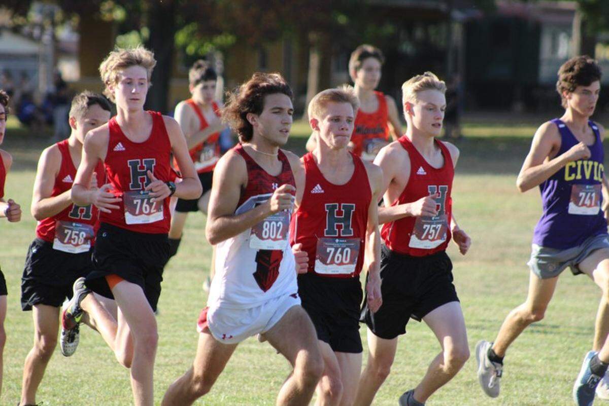 Highland boys cross country runners Dallas Mancinas, Mason Steinbeck, Easton Rosen, and Josh Loeh get ready for the start of the MVC Championship Meet at Mascoutah High School in 2020. Mancinas and Steinbeck are two of Highland’s key returnees this fall.