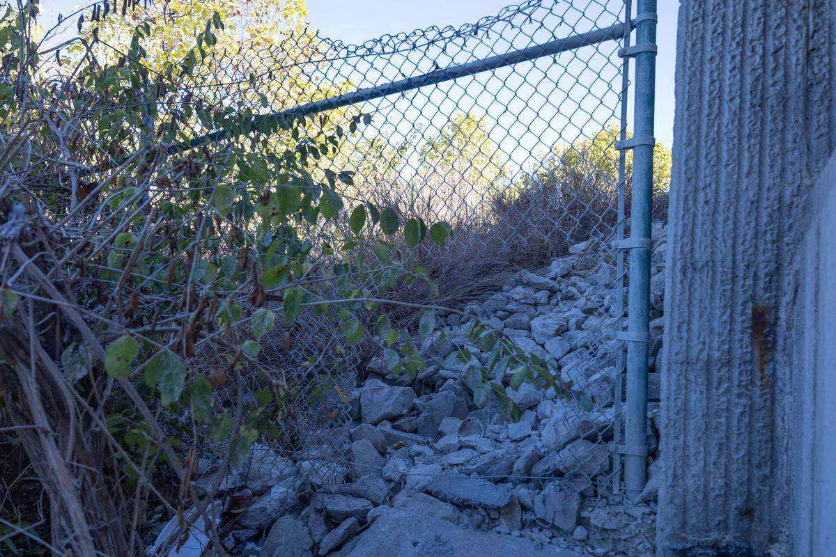A broken fence in Cahokia Heights next to Interstate 255 and near Illinois 163.