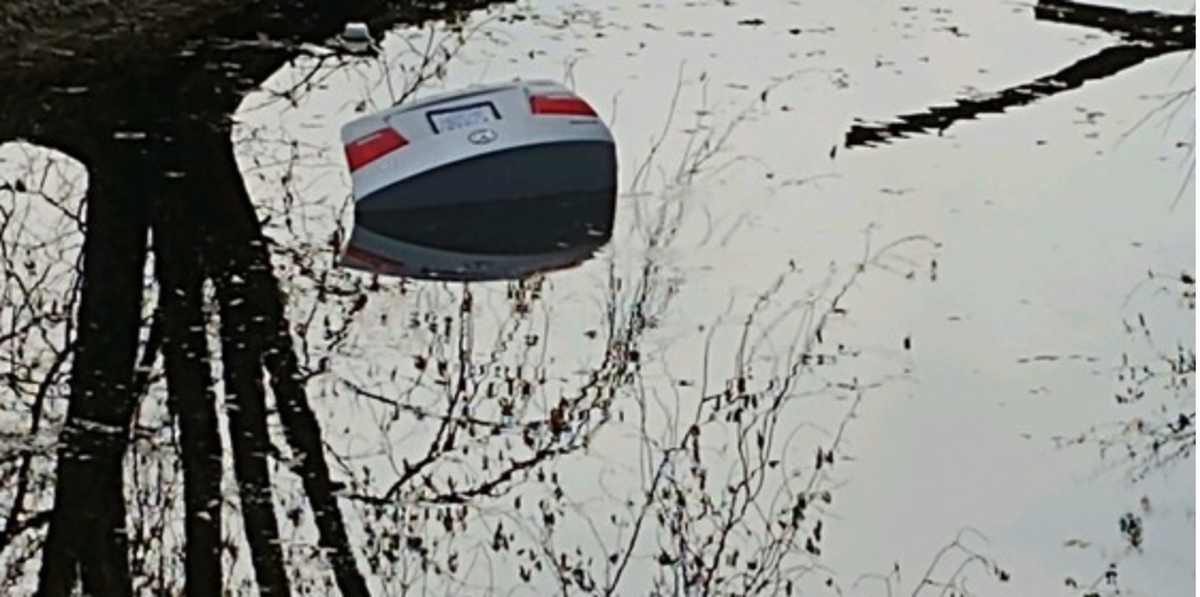 Police in Indiana say an officer rescued a woman from a submerged car.