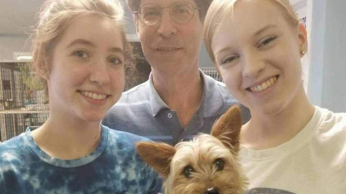 Madison County Board Chairman Kurt Prenzler poses with Mimi, a Yorkie he helped rescue in August 2017.