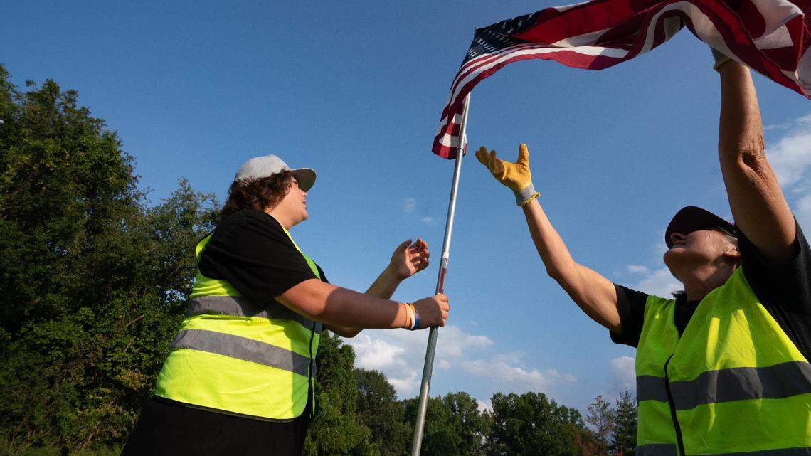 Volunteers line 7 miles of Main Street with flags to honor fallen Belleville Marine