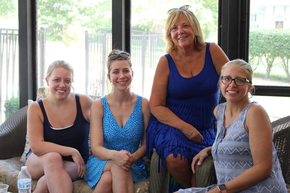 Tracy Kuehn, second from right, poses with her daughters, left to right, Kim Russ, Kacie Kuehn and Kristen Stensby, who persuaded her to take a DNA test.